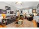 Cozy living room featuring hardwood floors, neutral tones, natural light, and comfortable seating at 1005 S Main St., Mullins, SC 29574
