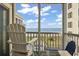 Relaxing screened balcony boasting a view of the beach and ocean beyond at 1011 S Ocean Blvd. # 301, North Myrtle Beach, SC 29582
