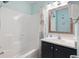 Functional bathroom with a clean shower-tub and vanity combo, showcasing a well-organized space at 1011 S Ocean Blvd. # 301, North Myrtle Beach, SC 29582