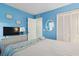 Bright bedroom featuring a bed, storage dresser, and a closet with louvered doors at 1011 S Ocean Blvd. # 301, North Myrtle Beach, SC 29582