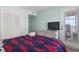 Relaxing bedroom featuring a dresser with mounted TV, and access to a balcony with scenic views at 1011 S Ocean Blvd. # 301, North Myrtle Beach, SC 29582