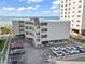 Beach condo building showing multiple floors with covered parking and an ocean view at 1011 S Ocean Blvd. # 301, North Myrtle Beach, SC 29582