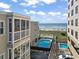 Stunning aerial view showcasing pools, the ocean, and beautifully maintained condos at 1011 S Ocean Blvd. # 301, North Myrtle Beach, SC 29582