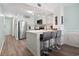 Contemporary kitchen featuring stainless steel appliances, a center island, and a breakfast bar at 1011 S Ocean Blvd. # 301, North Myrtle Beach, SC 29582