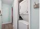 Modern stacked washer and dryer in a compact laundry area at 1011 S Ocean Blvd. # 301, North Myrtle Beach, SC 29582