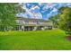 Large grassy backyard with screened-in porches offering a relaxing outdoor space at 1025 Penny Ln. # 1025, Myrtle Beach, SC 29577