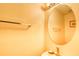 This half-bathroom features a round mirror, towel rack, and neutral walls at 1025 Penny Ln. # 1025, Myrtle Beach, SC 29577