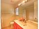 Cozy bathroom featuring a sink with decorative accents, a framed mirror, and a shower-tub combo at 1025 Penny Ln. # 1025, Myrtle Beach, SC 29577