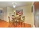 Cozy dining area featuring a round table, four chairs, and a decorative painting at 1025 Penny Ln. # 1025, Myrtle Beach, SC 29577