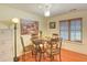 Cozy dining area featuring a round table, four chairs, and a decorative wall art at 1025 Penny Ln. # 1025, Myrtle Beach, SC 29577