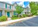 Exterior view of the townhomes with green doors and landscaping at 1025 Penny Ln. # 1025, Myrtle Beach, SC 29577