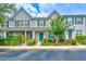 Inviting townhomes featuring colorful doors, brick accents, and lush landscaping at 1025 Penny Ln. # 1025, Myrtle Beach, SC 29577