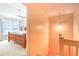 View of hallway and a bedroom featuring a wooden bed frame and natural light from the window at 1025 Penny Ln. # 1025, Myrtle Beach, SC 29577