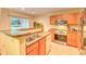 Bright kitchen with stainless steel appliances and a breakfast bar, perfect for casual dining at 1025 Penny Ln. # 1025, Myrtle Beach, SC 29577
