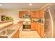 Well-equipped kitchen featuring modern appliances, ample counter space, and wooden cabinetry at 1025 Penny Ln. # 1025, Myrtle Beach, SC 29577
