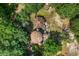 Aerial view of a unique home surrounded by lush greenery and mature trees at 10381 Hardwick Rd., Nichols, SC 29581