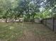 Expansive backyard featuring a storage shed and privacy fence at 10381 Hardwick Rd., Nichols, SC 29581