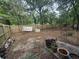 Spacious backyard with wooden fence, trees and a small shed at 10381 Hardwick Rd., Nichols, SC 29581