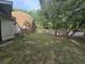 Lush backyard with a wooden fence and view of the dome home at 10381 Hardwick Rd., Nichols, SC 29581