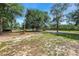 Grassy yard with mature trees and playground equipment on the property at 10381 Hardwick Rd., Nichols, SC 29581