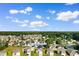 Overhead shot of a residential area with cozy homes, expansive skies and tree coverage at 1128 Sennema Circle, Myrtle Beach, SC 29588