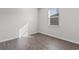 Bedroom featuring wood-look flooring and a window that provides ample natural light at 1128 Sennema Circle, Myrtle Beach, SC 29588