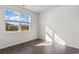 Bright bedroom with a large window offering neighborhood views and wood-look flooring at 1128 Sennema Circle, Myrtle Beach, SC 29588