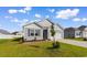 Charming one-story home with gray siding, well-manicured lawn, and an attached one car garage at 1128 Sennema Circle, Myrtle Beach, SC 29588