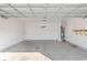 Spacious garage with ample room for parking and storage, complemented by essential utility fixtures at 1128 Sennema Circle, Myrtle Beach, SC 29588