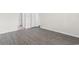 Hallway with neutral walls, white trim, and luxury vinyl plank flooring at 1128 Sennema Circle, Myrtle Beach, SC 29588