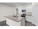 Open kitchen with granite counters, stainless steel appliances, and white cabinets at 1128 Sennema Circle, Myrtle Beach, SC 29588