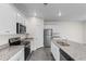 Beautiful kitchen showcasing granite countertops, stainless steel appliances, and white cabinetry at 1128 Sennema Circle, Myrtle Beach, SC 29588