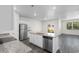 Spacious kitchen featuring granite countertops, stainless steel appliances, and a large island at 1128 Sennema Circle, Myrtle Beach, SC 29588