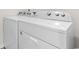 Close up of a white washer and dryer set, perfect for in-home laundry convenience at 1128 Sennema Circle, Myrtle Beach, SC 29588