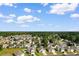 Overhead view of a community with beautiful homes surrounded by lush trees and landscaping at 1128 Sennema Circle, Myrtle Beach, SC 29588