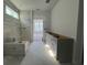 Bathroom with decorative tiled shower and long vanity at 1205 Grinnell St., North Myrtle Beach, SC 29582