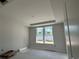 Bedroom with natural light from a double window and a recessed ceiling feature at 1205 Grinnell St., North Myrtle Beach, SC 29582