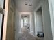Hallway with light walls, white trim, and multiple open doorways at 1205 Grinnell St., North Myrtle Beach, SC 29582