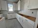 Bright kitchen with plenty of white cabinets and countertop space at 1205 Grinnell St., North Myrtle Beach, SC 29582