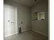 A blank canvas laundry room features essential connections, awaiting appliances to complete this functional space at 1205 Grinnell St., North Myrtle Beach, SC 29582