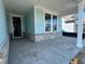 Open porch with craftsman style brick facade and light blue siding detail at 1205 Grinnell St., North Myrtle Beach, SC 29582