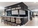 Finished basement bar with marble counters, cabinets, decorative columns, and seating for five at 1239 Maxwell Dr., Little River, SC 29566