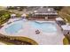 An aerial view of a stunning community pool and amenity center with lounge chairs and covered seating areas at 1239 Maxwell Dr., Little River, SC 29566