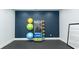 Exercise room with yoga mats, medicine balls, and other equipment against a dark blue wall at 1239 Maxwell Dr., Little River, SC 29566