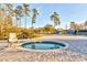 Inviting hot tub with a chair lift surrounded by an attractive paved patio area at 1239 Maxwell Dr., Little River, SC 29566