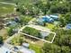 Aerial view of a landscaped lot highlighting the single-Gathering home, surrounded by lush trees in a desirable coastal neighborhood at 127 Brown Pelican Loop, Pawleys Island, SC 29585