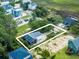 Aerial view of a home's lot outlining the single-Gathering property, featuring its lush backyard and private surroundings at 127 Brown Pelican Loop, Pawleys Island, SC 29585