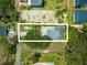 Overhead shot of the property showcasing the boat parking, surrounding greenery, and the home's placement on the lot at 127 Brown Pelican Loop, Pawleys Island, SC 29585