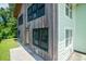 Exterior detail showing the home's wood siding and classic double hung windows at 127 Brown Pelican Loop, Pawleys Island, SC 29585