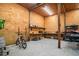 Well-lit garage with space for storage, a workbench, and a parked bicycle at 127 Brown Pelican Loop, Pawleys Island, SC 29585